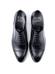 Czarne Eleganckie obuwie z ażurkami i dekoracyjnymi zdobieniami typu brogues. Szyte metodą  goodyear welted. TLB 547s Boxcalf Negro.
