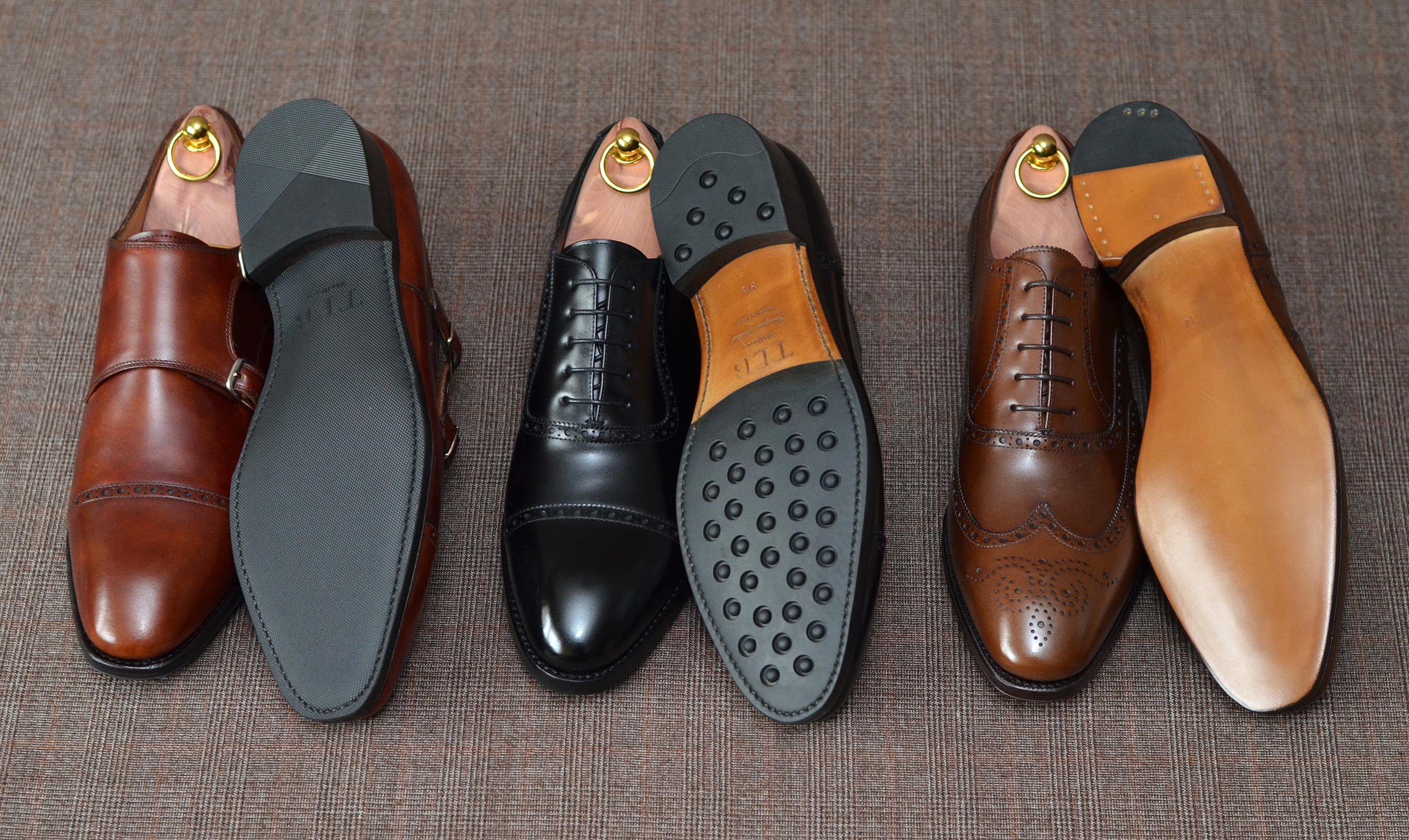 zestawienie luksusowych butów męskich z różnymi rodzajami podeszw spodów skórzane vs gumowe